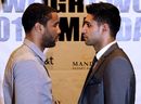 Lamont Peterson and Amir Khan square off during a press conference