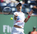 Novak Djokovic fires a forehand return