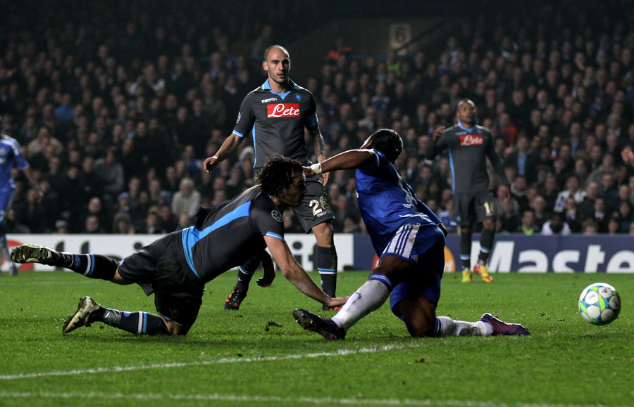 Didier Drogba is bundled over by Salvatore Aronica