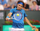 Roger Federer eyes a backhand