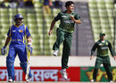 Aizaz Cheema watches as Mahela Jayawardene offers a catch to the off side