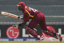 Dwayne Bravo sets off on a run during his innings of 54 