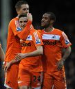 Joe Allen is congratulated by his team-mates after scoring his side's third goal