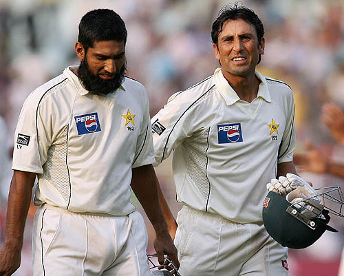 Mohammad Yousuf and Younis Khan walk off the field after the match ended in a draw