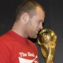 Wayne Rooney poses with the FIFA World Cup Trophy