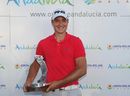 Julien Quesne holds the trophy after winning the Open de Andalucia