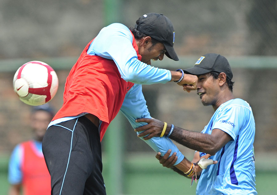Nuwan Kulasekara play fights with a team-mate