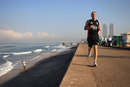 Andy Flower runs along the seafront