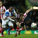 Junior Hoilett competes with Michael Turner