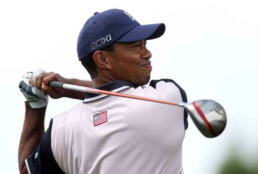 Tiger Woods grimaces at his shot