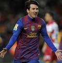 Lionel Messi celebrates breaking the Barcelona scoring record