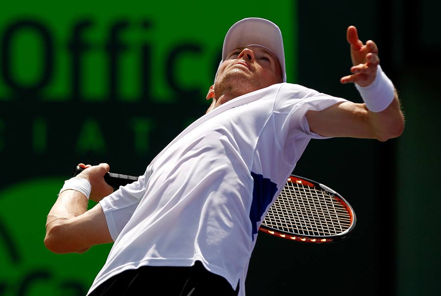 Nikolay Davydenko arches his back into a serve