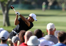 Fans watch as Tiger Woods tees off