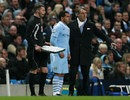 Roberto Mancini gives instructions to Carlos Tevez