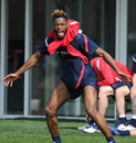 Alex Song plays up for the cameras at Arsenal training