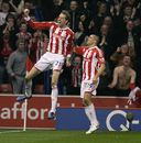 Peter Crouch leaps for joy after scoring