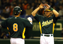 Two Oakland A's players congratulate each other