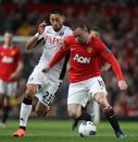 Wayne Rooney holds off Clint Dempsey