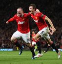 Wayne Rooney celebrates his goal with Jonny Evans