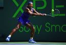 Serena Williams hammers a backhand