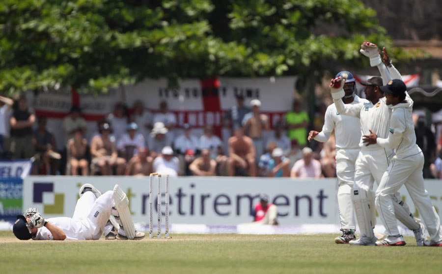 Jonathan Trott lies dazed on the floor after being stumped