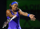 Serena Williams throws her arms up in frustration