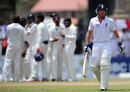 Ian Bell walks off after being trapped lbw