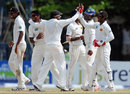 Mahela Jayawardene high-fives his namesake Prasanna as Sri Lanka celebrate their 75-run victory