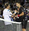 Novak Djokovic shakes hands with David Ferrer