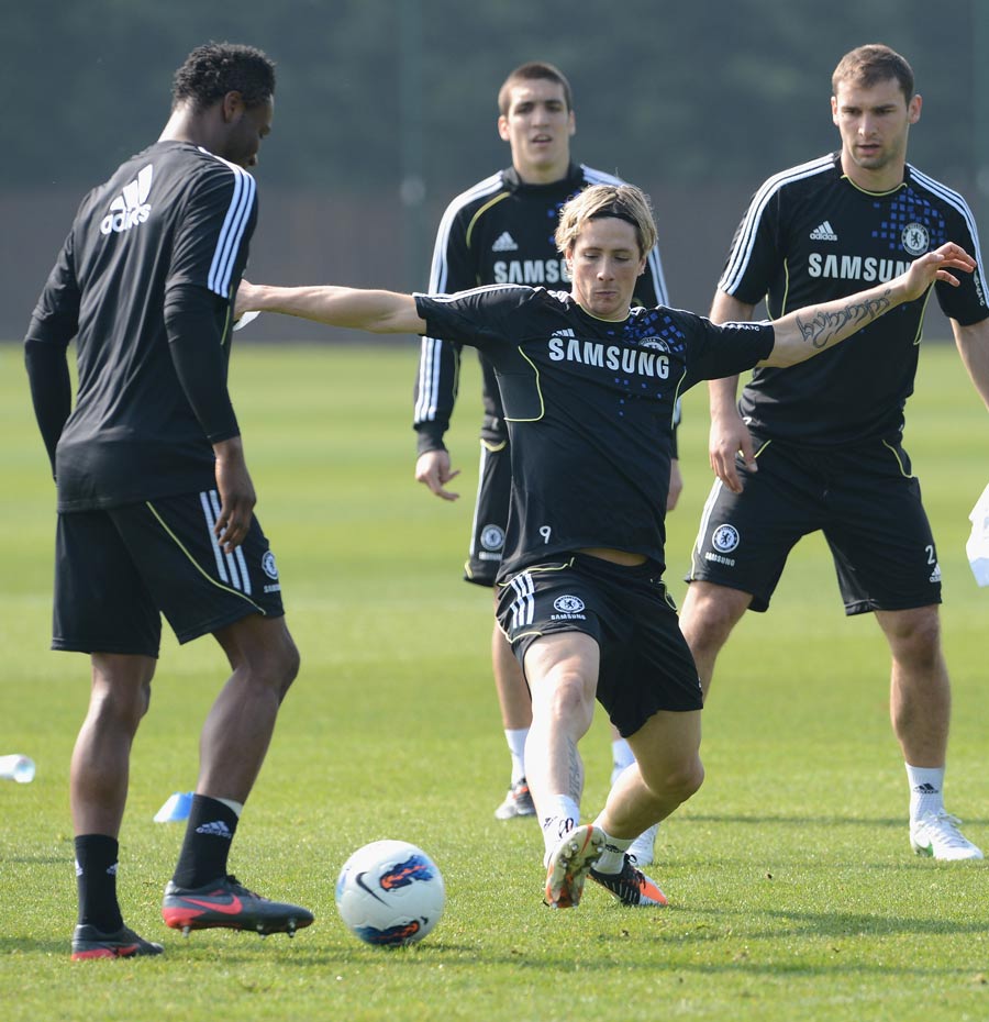 Fernando Torres hunts the ball during a training session