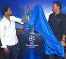 Celestine Babayaro and Ruud Gullit unveil the Champions League trophy 