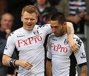 Clint Dempsey and John Arne Riise celebrate a Fulham goal