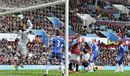 James Collins manages to squeeze the ball past Petr Cech