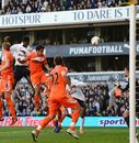 Emmanuel Adebayor heads in Spurs' second goal