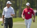Ernie Els and Lee Westwood walk up the eighth hole