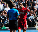 Andy Carroll remonstrates with referee Martin Atkinson 