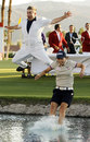 Sun Young-Yoo and her caddie Adam Woodward celebrate victory by jumping into the water