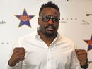 Dereck Chisora poses for the cameras to show his support for Barbados' fighter Shawn Cox