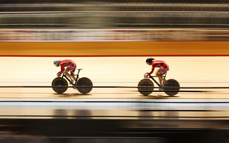 Philip Hindes, left, leads Sir Chris Hoy during training
