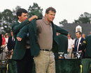 Larry Mize presents Sandy Lyle with his green jacket