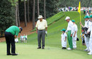 Arnold Palmer and Gary Player watch as Jack Nicklaus putts