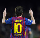 Lionel Messi salutes the crowd after scoring