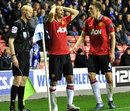 Ryan Giggs and Phil Jones question a linesman