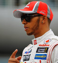 Lewis Hamilton gestures to his team