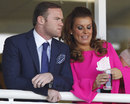 Wayne Rooney and his wife Coleen watch the racing