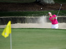 Luke Donald flips the ball out of the bunker