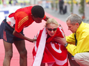 Haile Gebrselassie helps Paula Radcliffe