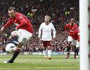 Wayne Rooney tucks home his penalty