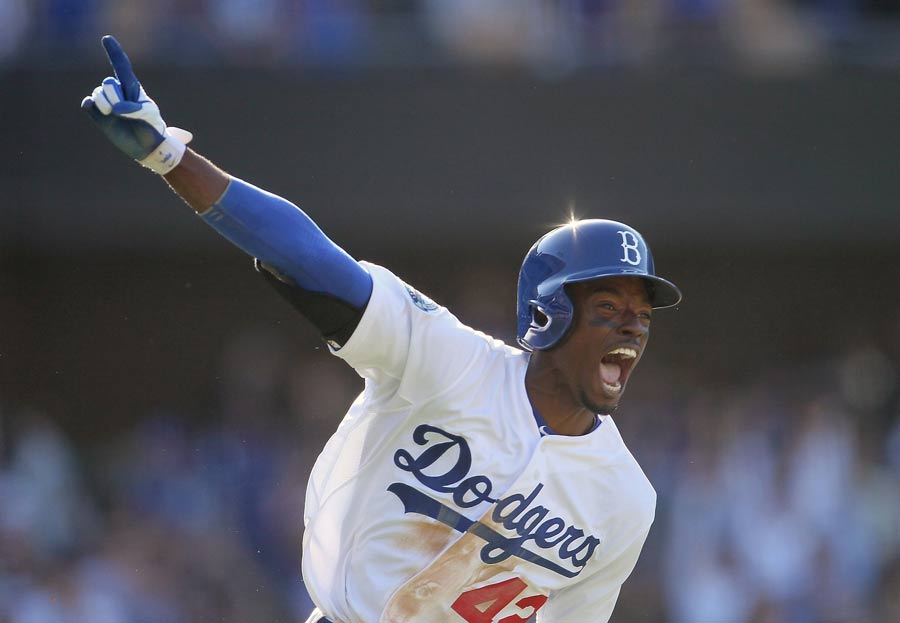 Dee Gordon of the Los Angeles Dodgers celebrates his game-winning single against the San Diego Padres