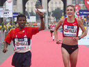 Haile Gebrselassie and Paula Radcliffe warm down after the race